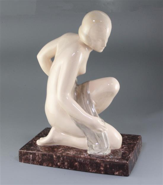 A French Art Deco crackle-glazed pottery model of a kneeling lady, signed M de Thierry, height 50cm